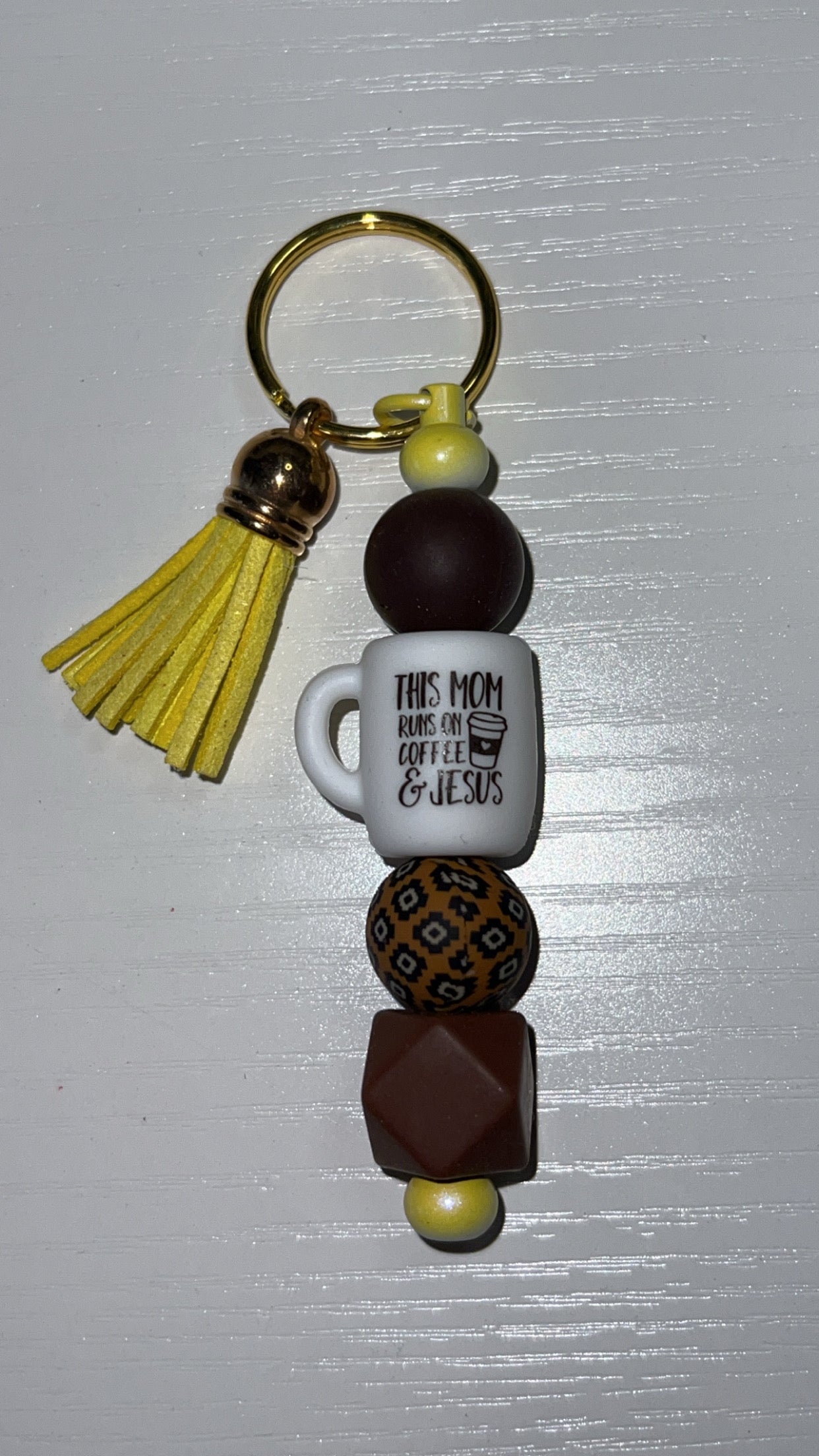 “This mom runs on coffee and Jesus” keychain